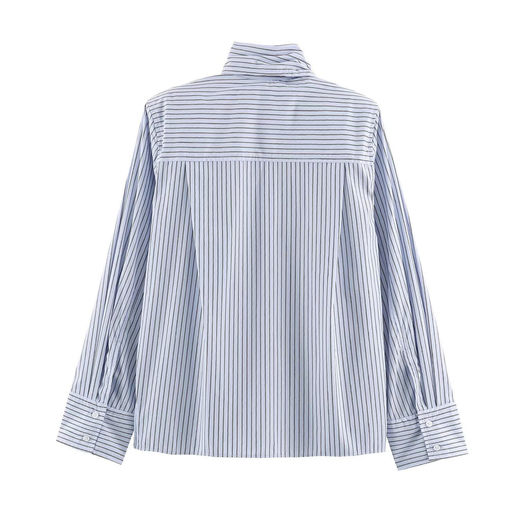 Women's striped shirt with shoulder pads buckle straps and collar