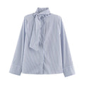 Women's striped shirt with shoulder pads buckle straps and collar